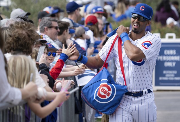 Brennen Davis greets Cubs fans before the preseason opener on Feb. 25, 2023, at Sloan Field in Mesa, Ariz.