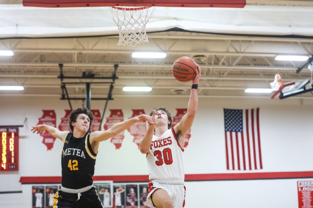 Yorkville's Bryce Salek (30) shoots a layup during a game against Metea Valley in Yorkville on Tuesday Feb. 6, 2024. (Troy Stolt for the Aurora Beacon News)