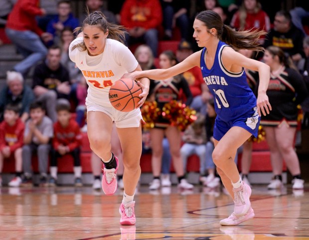 Batavia's Hallie Crane (24) moves the ball down the court against Geneva's Peri Sweeney (10) during the Class 4A Batavia Sectional final in Batavia on Thursday, Feb. 22, 2024. (Mark Black / The Beacon-News)