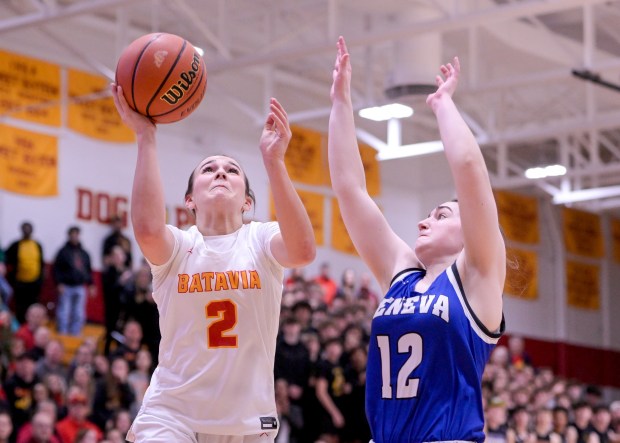 Batavia's Brooke Carlson (2) scores against Geneva's Gabby Webb (12) during the Class 4A Batavia Sectional final in Batavia on Thursday, Feb. 22, 2024. (Mark Black / The Beacon-News)