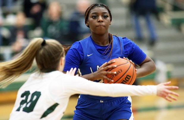 Larkin's Sanaii McPherson (22) sets to pass as Bartlett's Lilia Crawford (20)defends during an Upstate Eight Conference match up on Monday, Feb. 5, 2024 in Bartlett. Larkin won, 51-50.H. Rick Bamman / For the Beacon-News