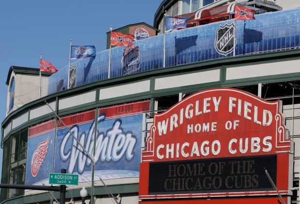 Banners and pennants for the New Year's Day's NHL Winter Classic hockey game are seen on the facade at Wrigley Field Dec. 29, 2008, in Chicago. (M. Spencer Green/Associated Press)