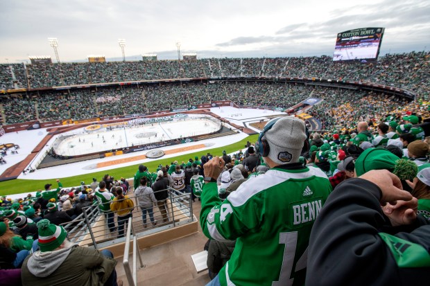 Dallas Stars fans watch play during the second period of the NHL Winter Classic hockey game between the Dallas Stars and the Nashville Predators at the Cotton Bowl, Wednesday, Jan. 1, 2020, in Dallas. Dallas won 4-2. (AP Photo/Jeffrey McWhorter)