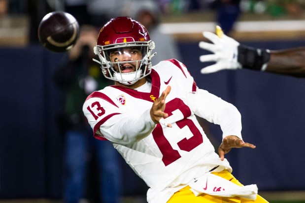 Southern California quarterback Caleb Williams (13) throws a pass sidearm during the first half of an NCAA college football game against Notre Dame, Oct. 14, 2023, in South Bend, Ind. (AP Photo/Michael Caterina)