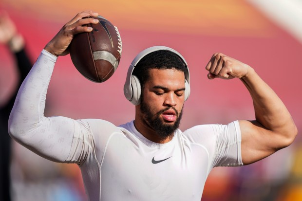 Southern California quarterback Caleb Williams warms up for the team's NCAA college football game against Washington, Saturday, Nov. 4, 2023, in Los Angeles. (AP Photo/Ryan Sun)