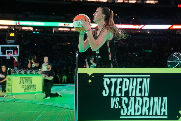 New York Liberty guard Sabrina Ionescu shoots during a competition against Golden State Warriors' Stephen Curry at the NBA basketball All-Star weekend, Saturday, Feb. 17, 2024, in Indianapolis. (Darron Cummings/AP)