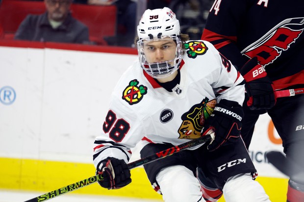 Chicago Blackhawks' Connor Bedard (98) watches the puck against the Carolina Hurricanes during the first period of an NHL hockey game in Raleigh, N.C., Monday, Feb. 19, 2024. (AP Photo/Karl B DeBlaker)