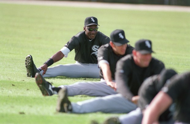 Michael Jordan, rear, stretches during the first day of the Chicago White Sox spring training workouts, Saturday, Feb. 18, 1995, Sarasota, Fla. Jordan supports the striking Chicago White Sox. As a minor leaguer, though, he doesn't want to get caught in the middle of the dispute. (AP Photo/Pat Sullivan)