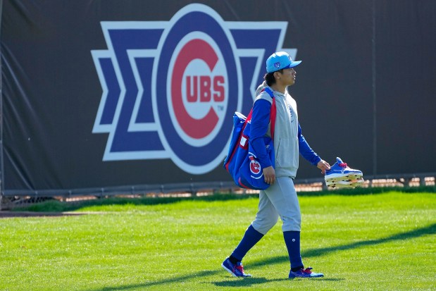 Cubs pitcher Shota Imanaga walks to the clubhouse after a spring training workout Wednesday in Mesa, Ariz.