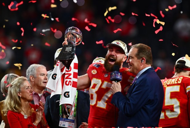 Kansas City Chiefs' Travis Kelce (87) holds the Vince Lombardi Trophy during the trophy ceremony after the Chiefs win the Super Bowl over the San Francisco 49ers in overtime at Allegiant Stadium in Las Vegas, Nev., on Sunday, Feb. 11, 2024. (Jos Carlos Fajardo/Bay Area News Group)