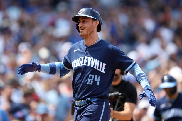 Chicago Cubs first baseman Cody Bellinger (24) celebrates as he crosses home plate after hitting s 2-run home run in the third inning of a game against the St. Louis Cardinals at Wrigley Field in Chicago on Friday, July 21, 2023. (Chris Sweda/Chicago Tribune)