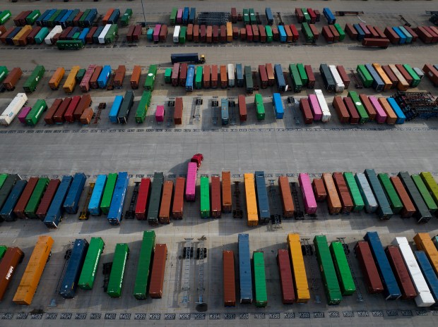 Trucks move containers at the Union Pacific Global IV intermodal yard near Joliet, Nov. 6, 2023. (E. Jason Wambsgans/Chicago Tribune)