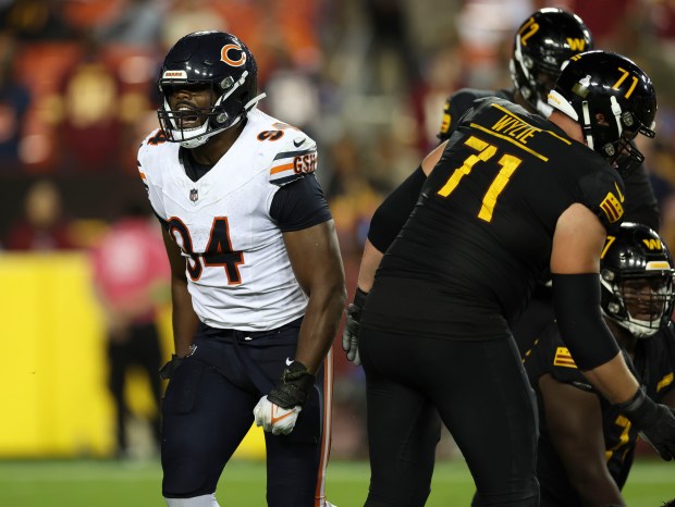 Bears defensive end Rasheem Green celebrates a sack of Commanders quarterback Sam Howell on Oct. 5, 2023, at FedEx Field. (Brian Cassella/Chicago Tribune)