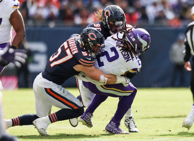 Bears linebacker Jack Sanborn (57) and defensive tackle Zacch Pickens tackle Vikings running back Alexander Mattison on Oct. 15, 2023, at Soldier Field. (Eileen T. Meslar/Chicago Tribune)