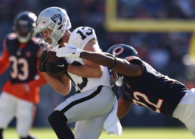 Bears safety Elijah Hicks attempts to tackle Raiders wide receiver Hunter Renfrow on Oct. 22, 2023, at Soldier Field. (Trent Sprague/Chicago Tribune)