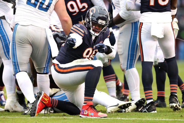 Bears defensive tackle Zacch Pickens celebrates after tackling Lions running back Jahmyr Gibbs on Dec 10, 2023, at Soldier Field. (Chris Sweda/Chicago Tribune)