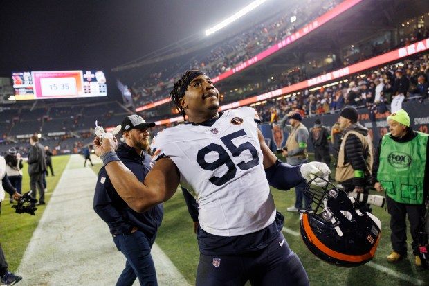 Bears defensive end DeMarcus Walker leaves the field after a victory over the Cardinals on Dec. 24, 2023, at Soldier Field. (Armando L. Sanchez/Chicago Tribune)