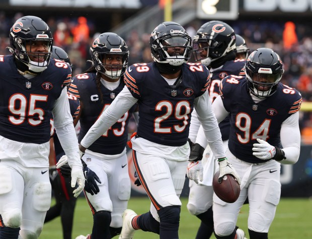 Bears cornerback Tyrique Stevenson celebrates his interception against the Falcons with teammates on Dec. 31, 2023, at Soldier Field. (Brian Cassella/Chicago Tribune)