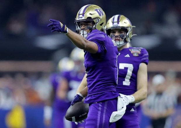 Washington's Rome Odunze celebrates after a first down against Texas during a CFP semifinal at the Sugar Bowl on Jan. 1, 2024, in New Orleans. (Jonathan Bachman/Getty Images)