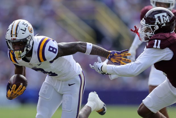 LSU's Malik Nabers runs with the ball against Texas A&M on Nov. 25, 2023, in Baton Rouge, La. (Jonathan Bachman/Getty Images)