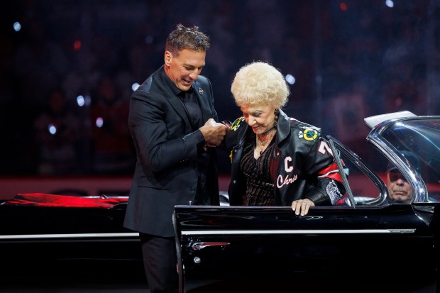 Chris Chelios and his mother, Sue, attend a ceremony to retire his No. 7 jersey before the Blackhawks play the Detroit Red Wings at the United Center Sunday Feb. 25, 2024 in Chicago. The Chicago native played for the Blackhawks for nine of his 26 NHL seasons. (Armando L. Sanchez/Chicago Tribune)