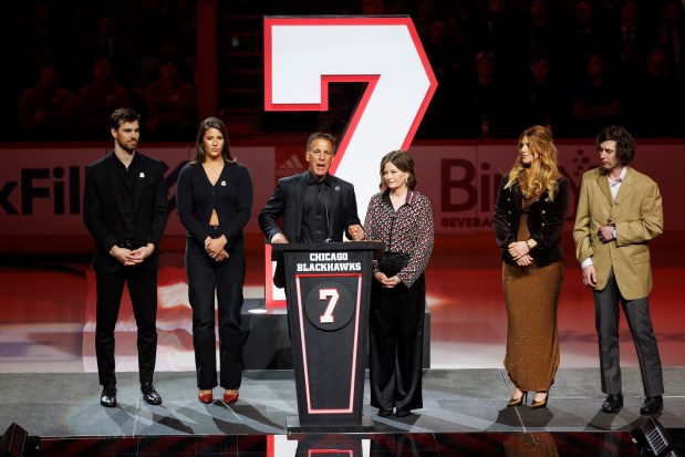 Chris Chelios and his family attend a ceremony to retire his No. 7 jersey before the Blackhawks play the Detroit Red Wings at the United Center Sunday Feb. 25, 2024 in Chicago. The Chicago native played for the Blackhawks for nine of his 26 NHL seasons. (Armando L. Sanchez/Chicago Tribune)