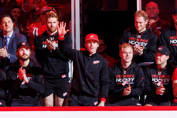 Patrick Kane waves to the United Center crowd while attending a ceremony to retire Chris Chelios's No. 7 Blackhawks jersey before the game on Feb. 25, 2024. (Armando L. Sanchez/Chicago Tribune)