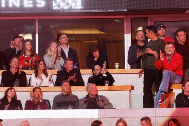 Theo Epstein and Eddie Vedder attend a ceremony to retire Chris Chelios's No. 7 Blackhawks jersey before the Blackhawks play the Detroit Red Wings at the United Center Sunday Feb. 25, 2024 in Chicago. The Chicago native played for the Blackhawks for nine of his 26 NHL seasons. (Armando L. Sanchez/Chicago Tribune)