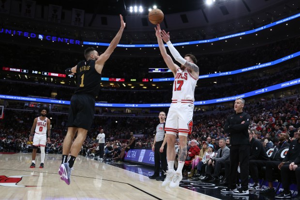 Bulls forward Onuralp Bitim (17) shoots as Cavaliers guard Max Strus (1) defends in the first half at the United Center in Chicago on Feb. 28, 2024. (Terrence Antonio James/Chicago Tribune)