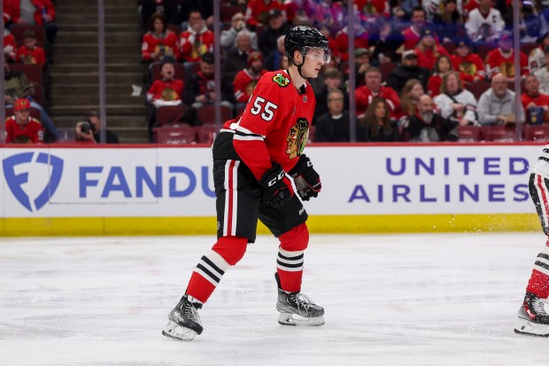 Chicago Blackhawks defenseman Kevin Korchinski (55) skates on the ice after losing his stick during the second period against the Detroit Red Wings at the United Center Sunday Feb. 25, 2024 in Chicago. (Armando L. Sanchez/Chicago Tribune)