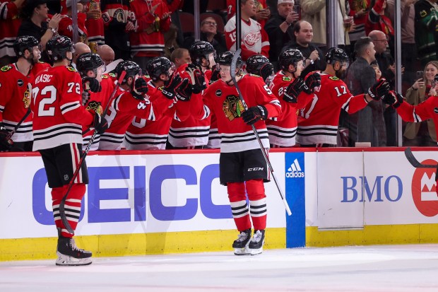 Chicago Blackhawks right wing MacKenzie Entwistle (58) celebrates with his team after scoring a goal during the second period against the Detroit Red Wings at the United Center Sunday Feb. 25, 2024 in Chicago. (Armando L. Sanchez/Chicago Tribune)