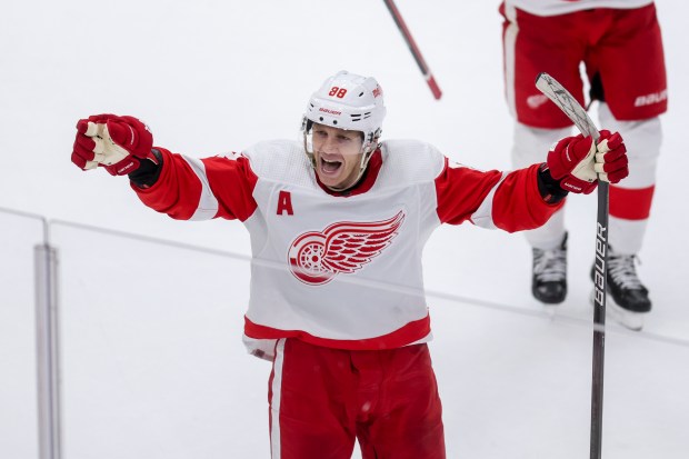 Detroit Red Wings right wing Patrick Kane (88) celebrates after scoring the game winning goal past Chicago Blackhawks goaltender Petr Mrazek (34) in overtime at the United Center Sunday Feb. 25, 2024 in Chicago. (Armando L. Sanchez/Chicago Tribune)