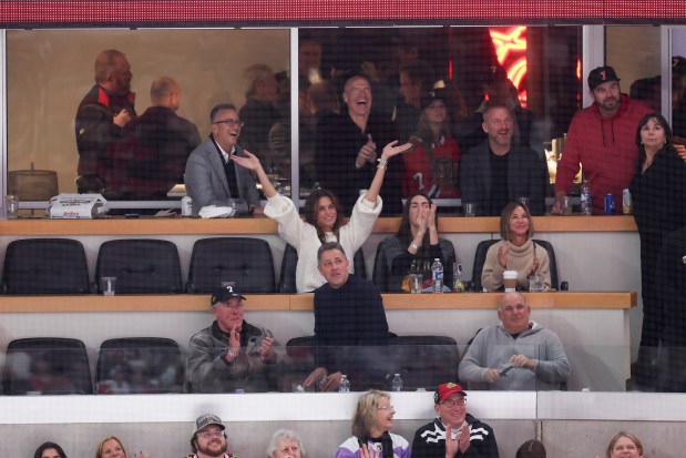 Cindy Crawford waves to the crowd while the Chicago Blackhawks play the Detroit Red Wings during the third period at the United Center Sunday Feb. 25, 2024 in Chicago. (Armando L. Sanchez/Chicago Tribune)