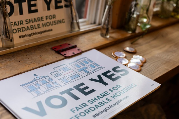 Buttons and posters at a Bring Chicago Home campaign event at Build Coffee shop in Chicago on Feb. 25, 2024. (Vincent D. Johnson / for the Chicago Tribune)