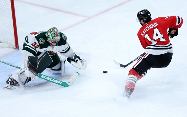 Chicago Blackhawks left wing Boris Katchouk (14) fails to score on Minnesota Wild goaltender Filip Gustavsson (32) in the third period of a game at the United Center in Chicago on Feb. 7, 2024. (Chris Sweda/Chicago Tribune)