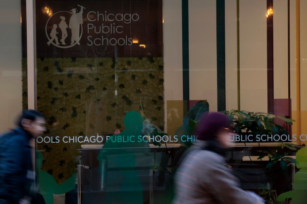 CPS signage on windows outside CPS headquarters on Thursday, Dec. 14, 2023. (Antonio Perez/Chicago Tribune)