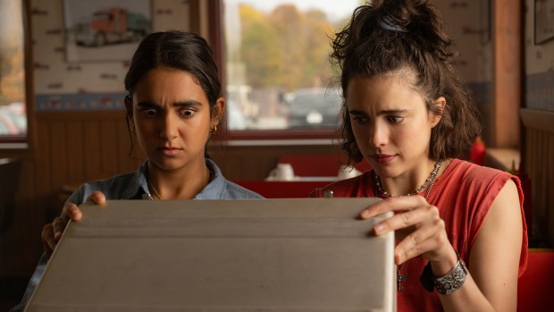 Geraldine Viswanathan, left, and Margaret Qualley in a scene from "Drive-Away Dolls." (Wilson Webb/Focus Features)