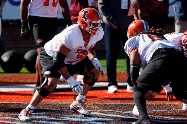 Illinois offensive lineman Isaiah Adams, left, runs through drills during practice for the Senior Bowl on Jan. 30, 2024, in Mobile, Ala. (Butch Dill/AP)