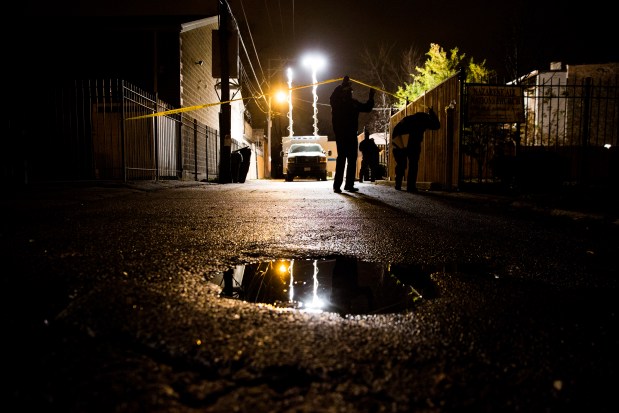 Police investigate the scene where Kajuan Raye was fatally shot by police Sgt. John Poulos in November 2016. Armando L. Sanchez/Chicago Tribune