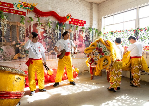 Performers prepare for a lion dance while they celebrate Lunar New Year on Feb. 11, 2024, at the Brighton Park Community Center.(Brian Cassella/Chicago Tribune)