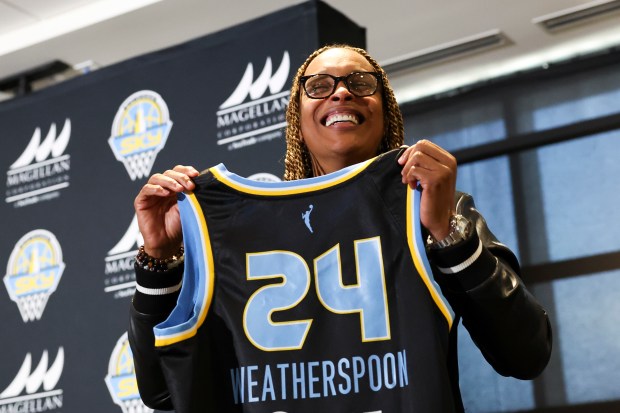 Chicago Sky Head Coach Teresa Weatherspoon holds up a jersey during an introductory press conference at Wintrust Arena on Tuesday, Oct. 24, 2023. (Eileen T. Meslar/Chicago Tribune)