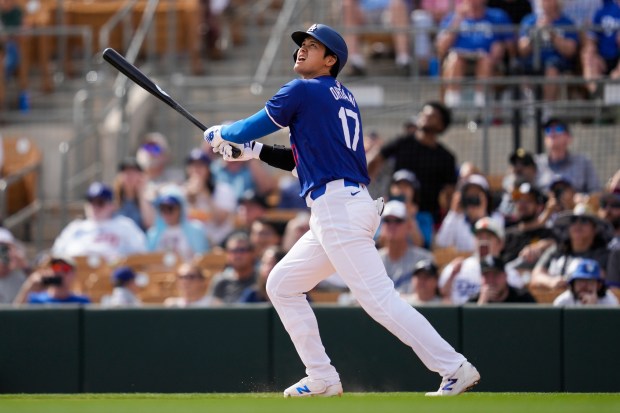 Dodgers designated hitter Shohei Ohtani watches his two-run homer during the fifth inning against the White Sox on Tuesday, Feb. 27, 2024, in Glendale, Ariz. (Ashley Landis/AP)