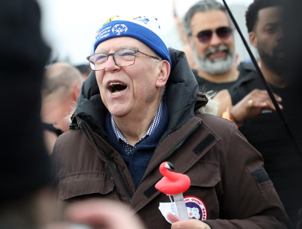 Meteorologist Tom Skilling talks to participants while they jump into Lake Michigan on March 6, 2022, during the annual Chicago Polar Plunge at North Avenue Beach. (Brian Cassella/Chicago Tribune)