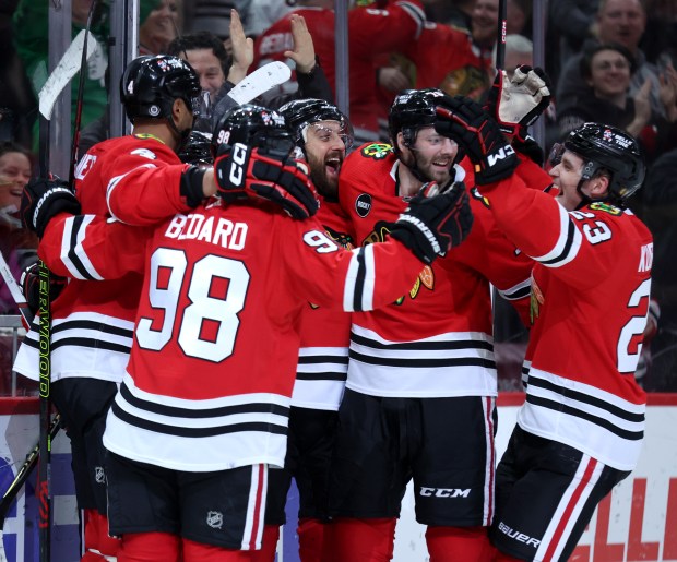 Blackhawks celebrate after center Tyler Johnson tied the game late in the third period against the Jets on Feb. 23, 2024, at the United Center. (Chris Sweda/Chicago Tribune)