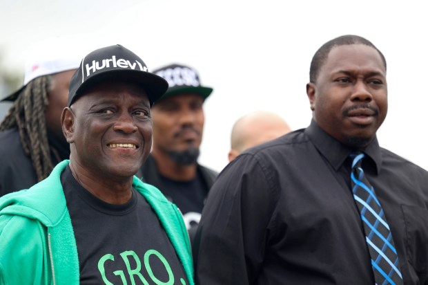 Lee Harris, left, next to his son, Jermaine Harris, during a news conference at the site of the former Cabrini-Green housing complex in September 2023. Lee Harris filed a federal civil rights lawsuit that month against the city. (Trent Sprague / Chicago Tribune)