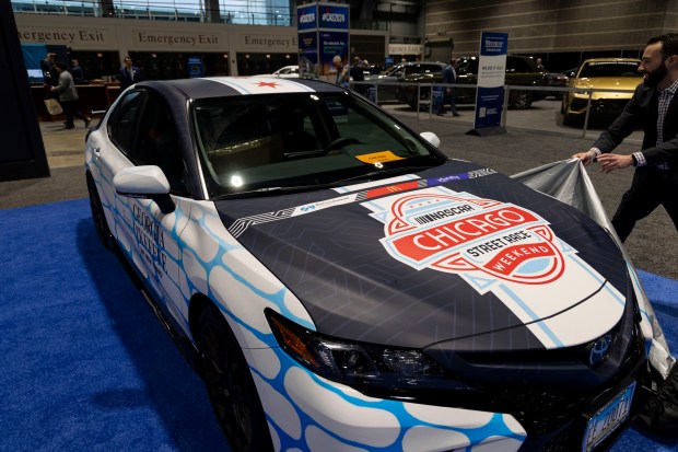 A wrapped Toyota Camry pace car for the 2024 NASCAR Chicago Street Race is unveiled at the Chicago Auto Show preview day, Feb. 8, 2024, at McCormick Place. (Brian Cassella/Chicago Tribune)