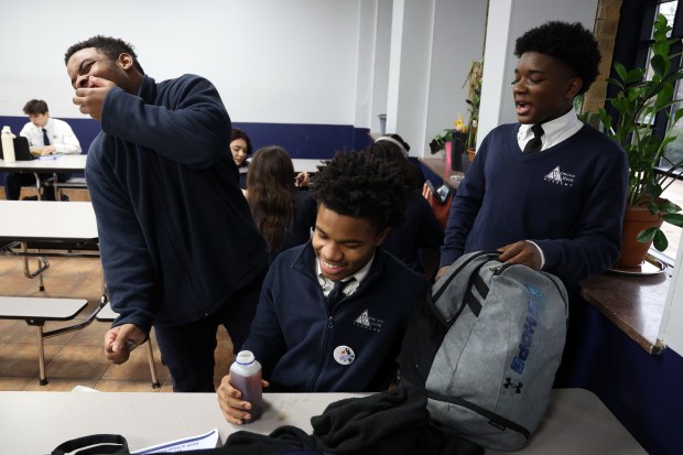 Senior Jaeveon Hilton, from left, senior Eddie Jenkins Jr., and, freshman Timothy Lawrence laugh during lunch at Hope Academy high school in Chicago on Jan. 30, 2024. (Terrence Antonio James/Chicago Tribune)