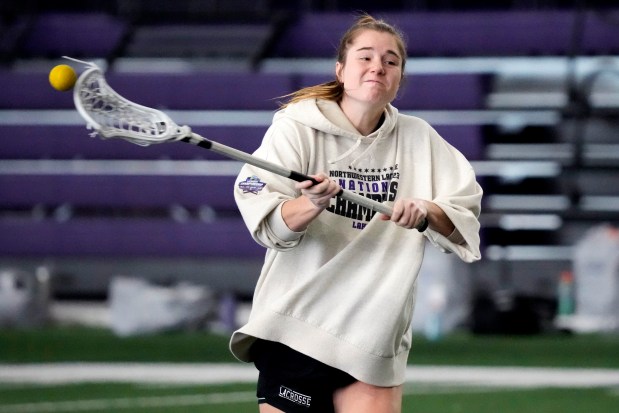 Northwestern's Izzy Scane warms up during the lacrosse team's practice in Evanston, Ill., Feb. 6, 2024. (AP Photo/Nam Y. Huh)