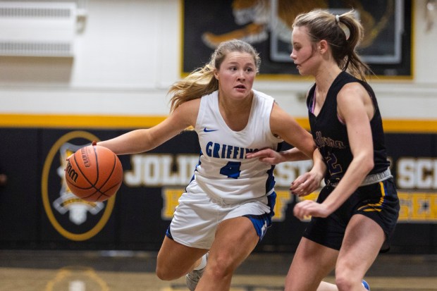 Lincoln-Way East's Alaina Vargas (4) tries to get in the lane against Sandburg's Zoe Trunk during the Class 4A Joliet West Sectional semifinals in Joliet on Tuesday, Feb. 20, 2024. (Vincent D. Johnson / Daily Southtown).