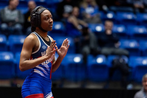 West Aurora's Kameyah Young signals she wants to start the second period against Glenbard West's Alycia Perez in the girls wrestling championship match at 100 pound at Grossinger Motors Arena in Bloomington on Saturday, Feb. 24, 2024. (Vincent D. Johnson / Daily Southtown)